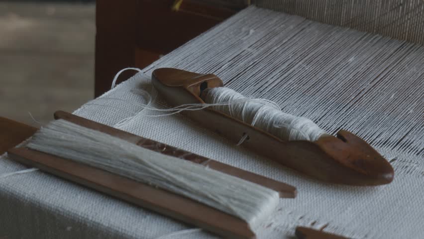 Camera Moving Over Loom with Shuttle and Threads Left to Right
