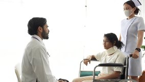 An orthopedic surgeon and a registered nurse assess a trauma patient with a potential cervical spine injury. The patient is immobilized in a cervical collar and wheelchair for evaluation. - Powered by Shutterstock - Get 15% off with code: PIKWIZARD15