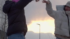This touching video shows friends and couples making heart shapes with their hands at sunset, expressing love and connection amid a serene glow - Powered by Shutterstock - Get 15% off with code: PIKWIZARD15