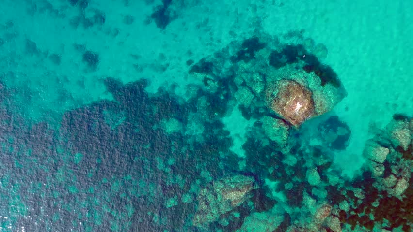 Rocky coast of Ibiza island, deep blue sea. Gorgeous aerial view flight drone