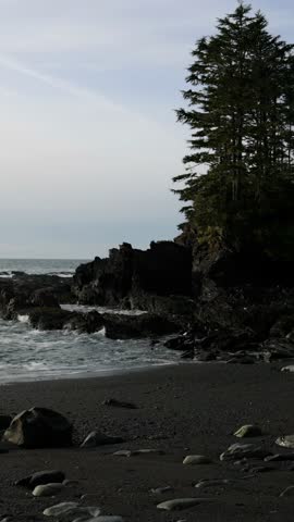 Scenic Vancouver Island Beach: Waves Against Rocky Shoreline and Coastal Forest Serenity