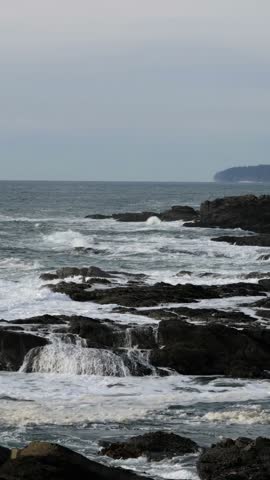 Powerful Ocean Waves Crashing Against Rocky Coastline of Vancouver Island, British Columbia, Canada