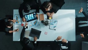 Time lapse of businessman using VR headset to visit virtual world while diverse start up team discuss about marketing strategy on table with financial graph placed at business meeting. Directorate. - Powered by Shutterstock - Get 15% off with code: PIKWIZARD15