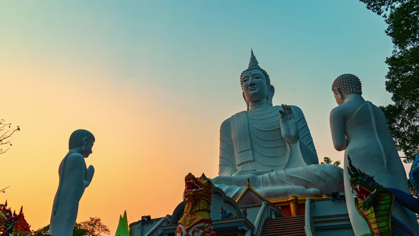 Statue of a standing monks paying homage to the Buddha in a serene temple, exudes a sense of reverence. The monk's posture and expression convey deep respect, symbolizing the profound spiritual