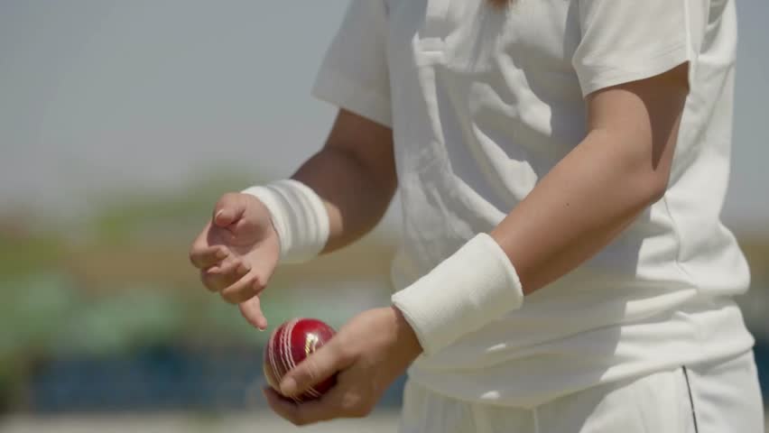 Close Up of Woman Bowler’s Hands Holding Cricket Ball in 4K Ultra HD | Female Cricketer Preparing to Bowl, Sports Training Detail, Hand Grip Technique and Athletic Focus - Powered by Shutterstock - Get 15% off with code: PIKWIZARD15