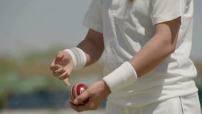 Close Up of Woman Bowler’s Hands Holding Cricket Ball in 4K Ultra HD | Female Cricketer Preparing to Bowl, Sports Training Detail, Hand Grip Technique and Athletic Focus - Powered by Shutterstock - Get 15% off with code: PIKWIZARD15