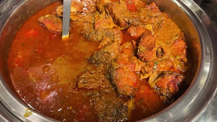 Katla fish curry prepared in Bengali style in an Indian wedding