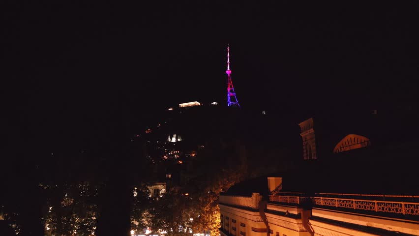 Tbilisi, Georgia - 28th october, 2024: illuminated Tbilisi television tower at night. Georgia Tbilisi TV Broadcasting Tower. Free-standing tower structure used for communications. Mtatsminda Park