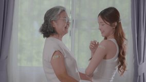 Happiness Asian senior woman and young woman are smiling happily in a room with colorful bandages on upper arms after vaccination. Health protect to sick from infectious diseases. happy health care.
 - Powered by Shutterstock - Get 15% off with code: PIKWIZARD15