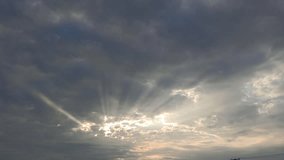Beautiful rays of sunlight penetrating the grey clouds in the sky (Crepuscular rays). in the sunrise.	 - Powered by Shutterstock - Get 15% off with code: PIKWIZARD15
