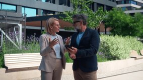 Diverse Business People Arguing Outdoors in Business District, Angry Man and Woman, Conflict and Tension Concept - Powered by Shutterstock - Get 15% off with code: PIKWIZARD15