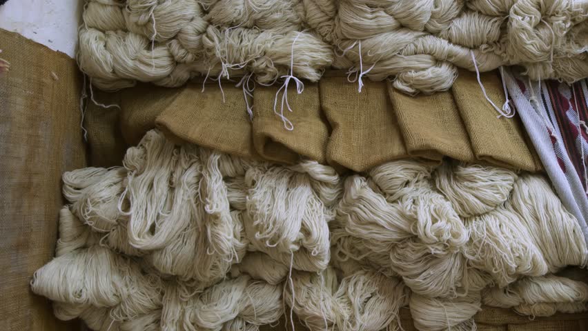 Weaving workshop in emirati heritage village.Traditional weaving techniques, including Sadu weaving, which produces colorful geometric patterns, and Khoos weaving