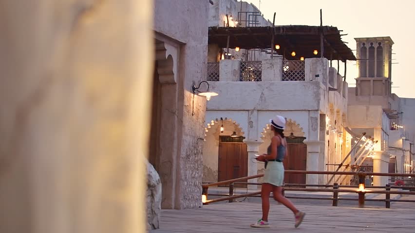 Dubai, UAE - 12th october, 2022: tourist walk explore sightseeing famous old Dubai creek landmark by old historical buildings