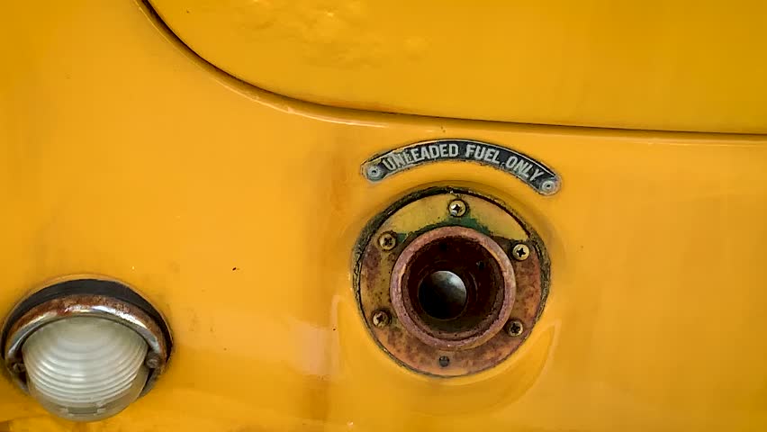 Fuel tank car with sign Unleaded fuel only premium ecology refueling retro cars