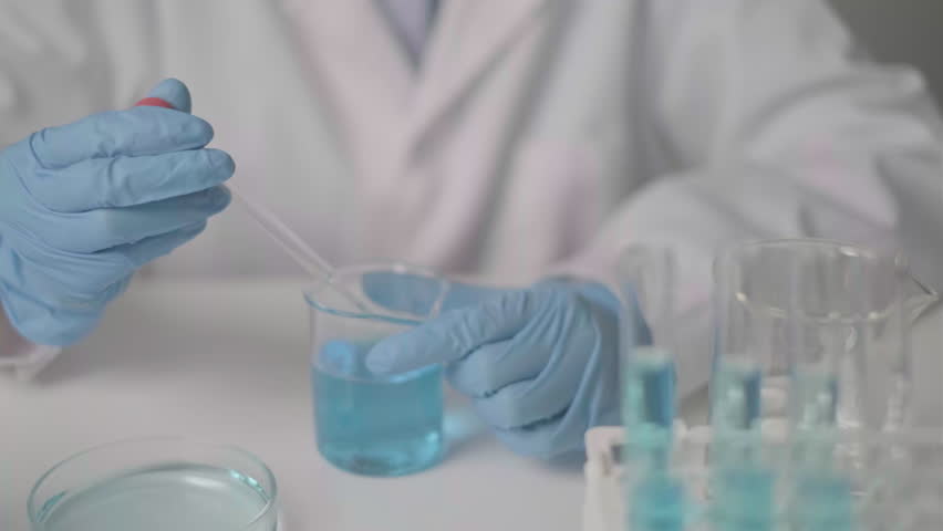 Woman doctor working in hospital laboratory research medicine test genetic analysis healthcare discovery innovation experiment white coat gloves examining study virus pharmaceutical analyzing exam - Powered by Shutterstock - Get 15% off with code: PIKWIZARD15