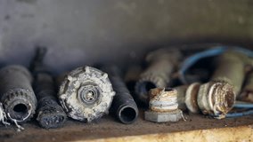 Stack of rusty cut pipes, tubes, hoses, valves and other working tools on shelf in abandoned basement or warehouse, steel equipments with corroded texture because of improper storage conditions - Powered by Shutterstock - Get 15% off with code: PIKWIZARD15