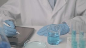 Professional Asian woman scientist chemist technician experiment research in chemistry laboratory data analysis result report scientific innovation document discovery writing paperwork planning note - Powered by Shutterstock - Get 15% off with code: PIKWIZARD15