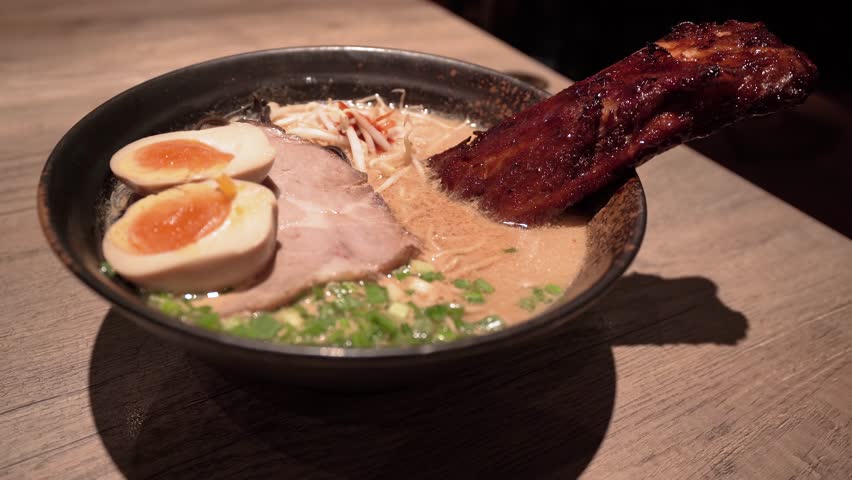 Pork broth based ramen topped with grilled marinated pork rib, slow cooked charsiu and soft boiled egg.