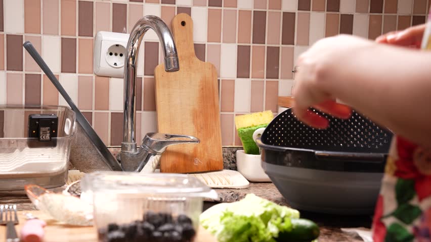 Hands Assembling Homemade Sandwich with Lettuce and Olives, Cinematic 4K