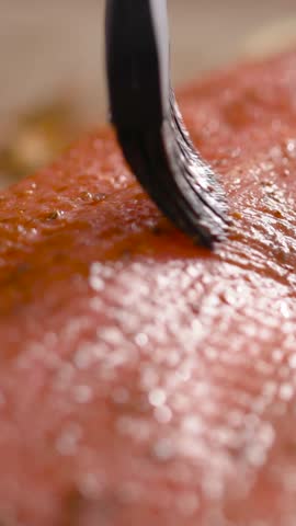 Grilling salmon with flavorful spices at a coastal backyard gathering in summer