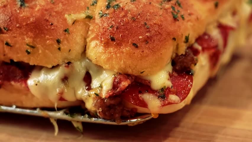 Pizza Sliders with bacon, Italian sauce, and pepperoni, a fun and savory appetizer perfect for party menus, casual dining, and gourmet snack lovers.