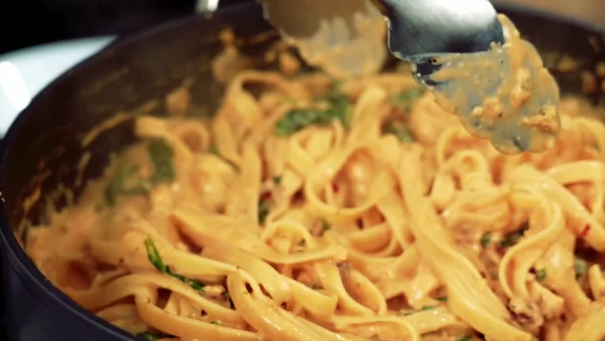 Salmon Pasta - Salmon with Spaghetti, creamy sauce and fresh herbs, plated elegantly for Italian cuisine, gourmet dining, and restaurant menus.