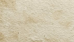 Beige kraft paper texture with soft creases and natural fiber inclusions, subtle uneven tone variations, fine organic speckles, detailed grunge animated background loop - Powered by Shutterstock - Get 15% off with code: PIKWIZARD15
