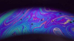 Spectrum ink fluid. Rainbow arch. Colorful round lens paint mix dye on black background. Blue purple green night blur abstract flow. - Powered by Shutterstock - Get 15% off with code: PIKWIZARD15