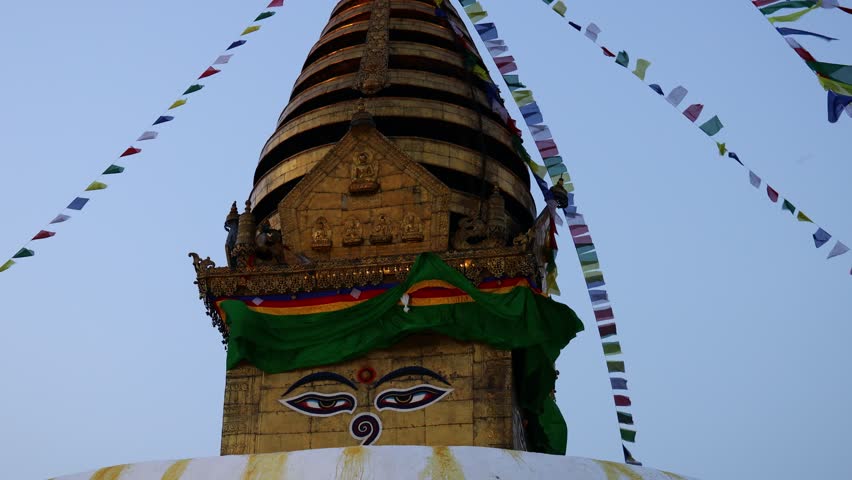 Stupa sacred place in Buddhist temple, Kathmandu , Nepal. Colorful prayer flags real time video around the stupa in Buddhist pagoda