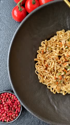 Instant noodles or ramen, Asian food, pasta with vegetables and spices. Noodles, takeaway food, instant meal