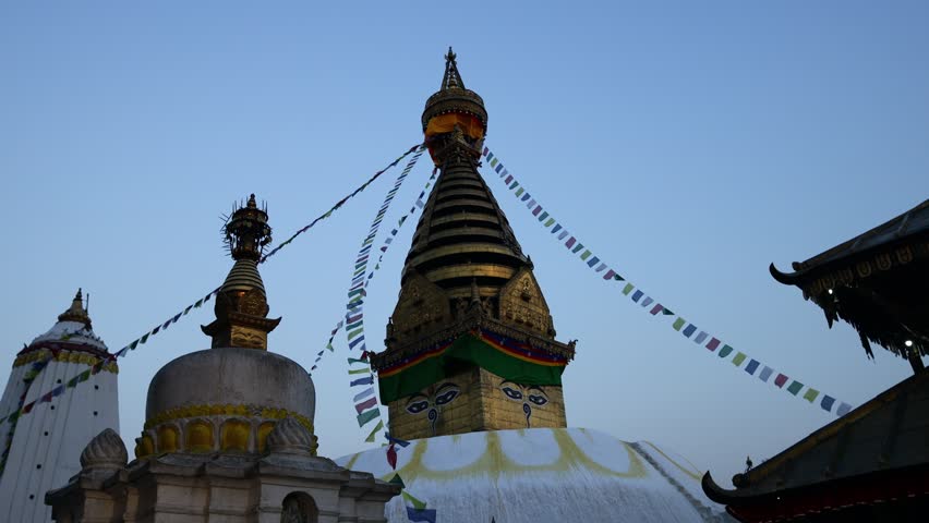 Stupa sacred place in Buddhist temple, Kathmandu , Nepal. Colorful prayer flags real time video around the stupa in Buddhist pagoda