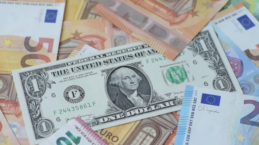 Paper money, euro and dollar bills, exchange rate fluctuations, cash for savings, investments and business operations. Paper cash euros and dollars as a financial background for your design
