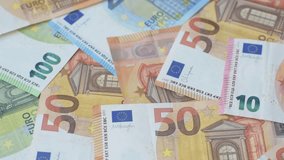 Paper money, euro notes, cash for savings, investments and business transactions. Euro paper cash as a financial background for your design - Powered by Shutterstock - Get 15% off with code: PIKWIZARD15