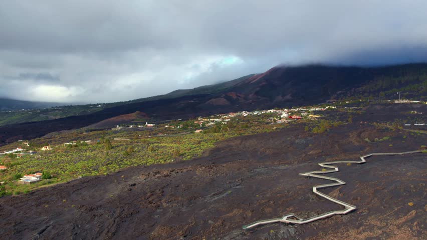 Lava field of the San Juan volcano on La Palma with visitor centre and footbridge over the cooled lava field