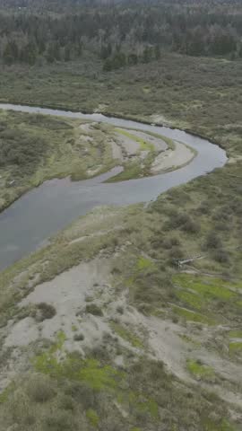 Aerial View of a Winding River Through Lush Landscape in British Columbia, Canada