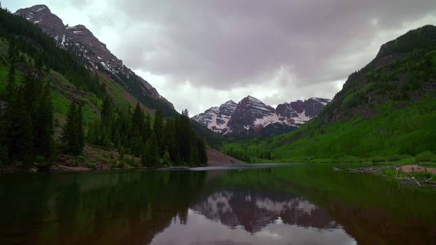 Aspen Snowmass Pyramid Peak Maroon Bells Wilderness 14ers mirror reflection Maroon Lake scenic landscape cloudy stormy sunset spring summer Elk Mountains Range Colorado Rocky Mountains
