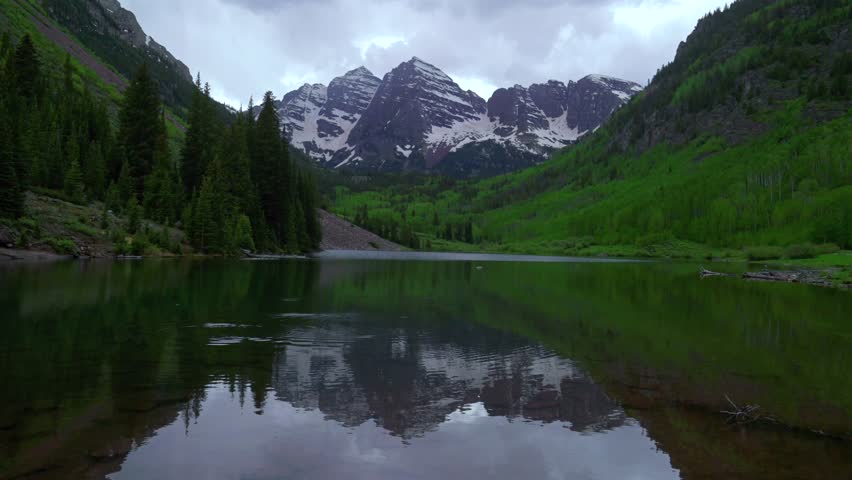 Maroon Bells Wilderness 14ers reflection Maroon Lake scenic landscape Aspen Snowmass cloudy stormy spring summer Elk Mountains Pyramid Peak Colorado Rocky Mountains most photographed panorama static