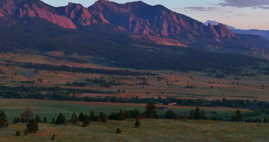 Flatirons Front Range Boulder Chautauqua Park morning sunrise aerial drone Colorado spring summer pink cloud first light on red slanted scenic nature Rocky Mountains parallax circle right