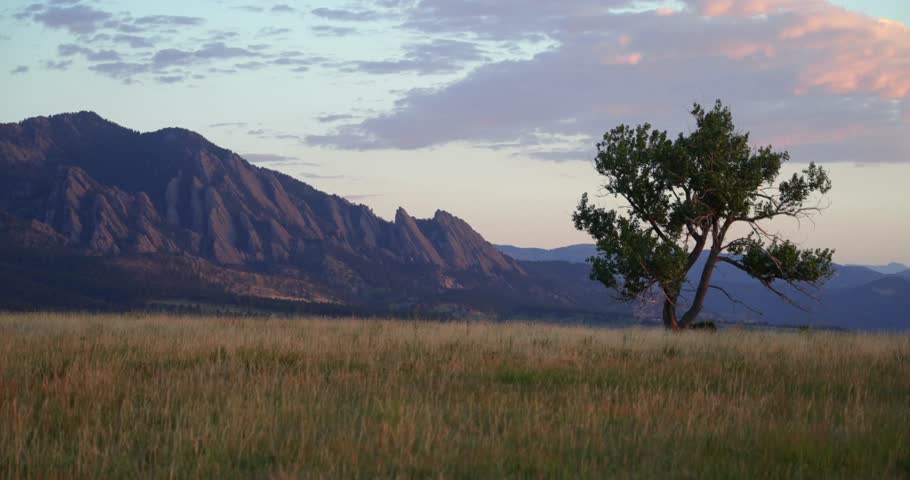 Flatirons Front Range Boulder Chautauqua Park morning sunrise aerial drone Colorado spring summer pink cloud first light on red slanted scenic nature boulder Rocky Mountains windy tree nature scenery