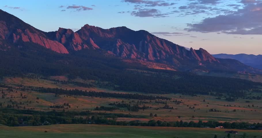 Cows Flatirons Front Range Boulder Chautauqua Park morning sunrise aerial drone Colorado spring summer pink cloud first light on red slanted scenic nature Rocky Mountains parallax circle right