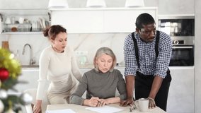 Elderly woman relatives tell her who to include in her will during Christmas celebrations. High quality 4k footage - Powered by Shutterstock - Get 15% off with code: PIKWIZARD15
