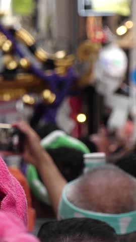 ASAKUSA, TOKYO,  JAPAN - MAY 20, 2019 : Scenery of SANJA MATSURI (SANJA FESTIVAL) on the mirror at the street in ASAKUSA.  Festival is one of the three great shinto festivals in Tokyo. Vertical video.