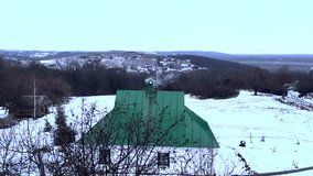 A mountain village in winter. Smoke is coming from the house, a snow-covered path goes down. Panorama. Rest in the village in winter. - Powered by Shutterstock - Get 15% off with code: PIKWIZARD15