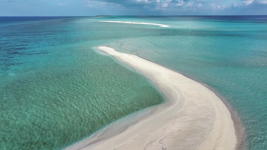 Aerial view of the pristine white sands of Goidhoo sandbank juxtaposed against the vivid turquoise waters, creating a stunning contrast, Goidhoo, Baa Atoll, Maldives.