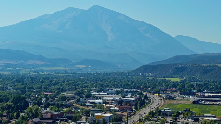 Tall peak rising above landscape with soft clouds, dramatic mountain backdrop in full view, Red Hill Carbondale Colorado