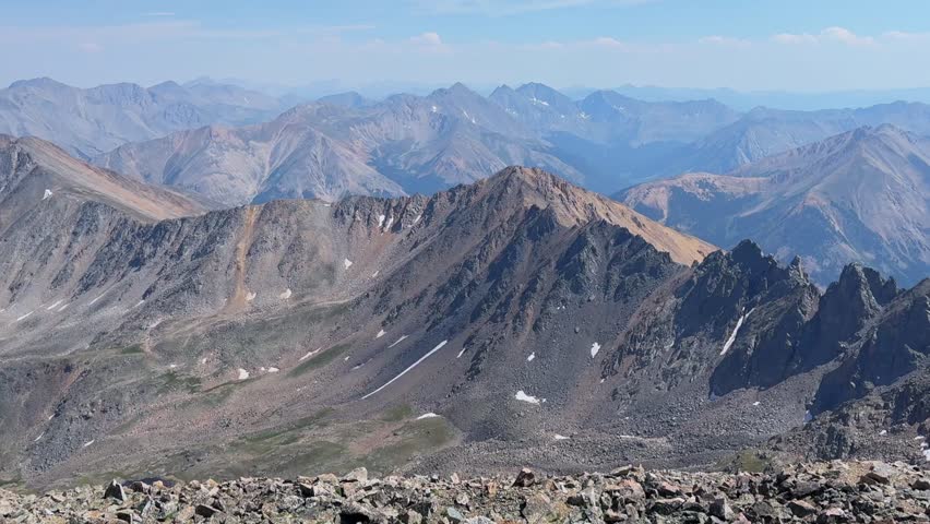 Summer Huron Peak Collegiate Peaks Independence Pass hiking trail La Plata Peak Sawatch Range Rocky Mountains top of summit 14er Colorado aerial drone blue sky clouds zoom in motion