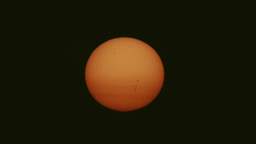 Closeup of the morning sun with sunspots