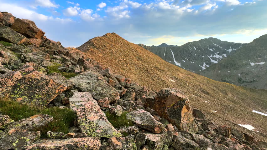 Mount of the Holy Cross 14er Rocky Mountain Sawatch Range Peak Colorado Alpine backcountry landscape view from Notch Mountain Shelter Halo Ridge spring summer Golden hour sunset pan right motion