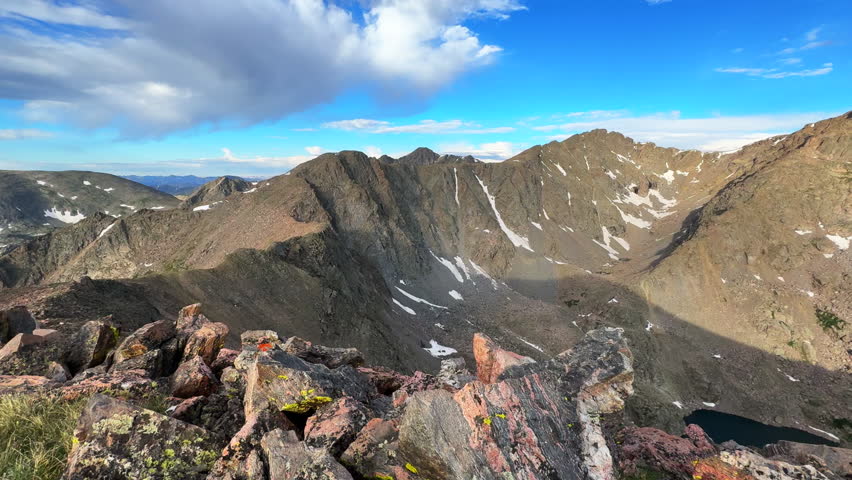 Halo Ridge trail Notch Mountain landscape view Mount of the Holy Cross Wilderness Peak 14er Colorado Sawatch Rocky Mountains sunny morning Tear of bowls alpine lake blue sky clouds pan right motion