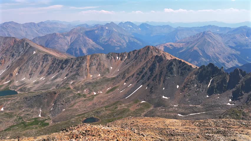 Summer summit of 14er La Plata Peak view Collegiate Peaks Sawatch Range spring summer Rocky Mountains Colorado North Apostle Mt Columbia Oxford Yale Harvard above treeline morning blue sky pan left